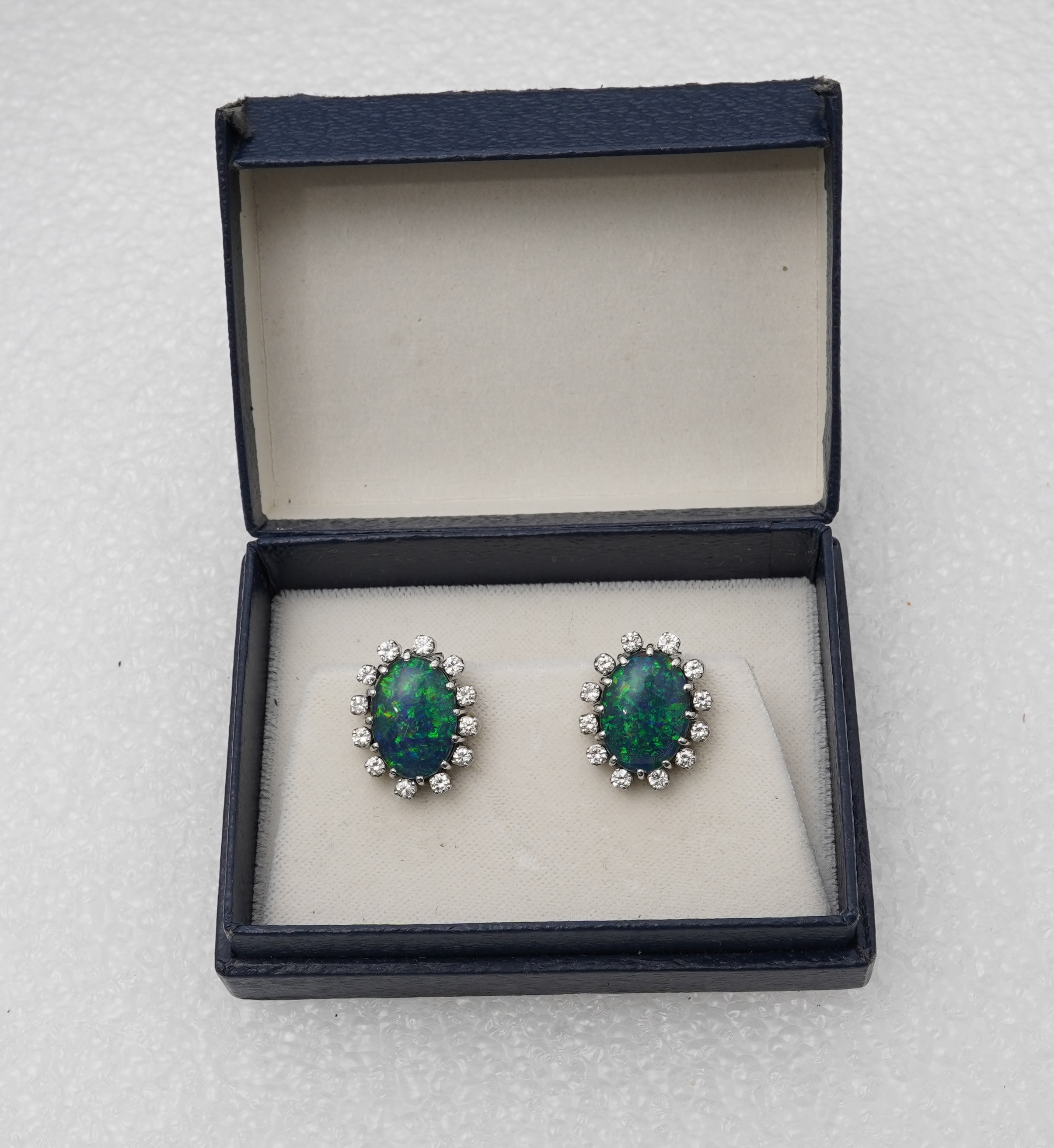 A pair of opal triplet and diamond earrings